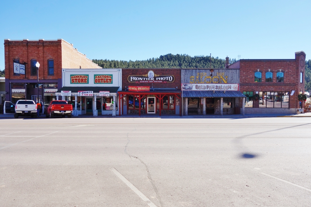 Picture of the main street in Custer showing shops and an old style saloon 