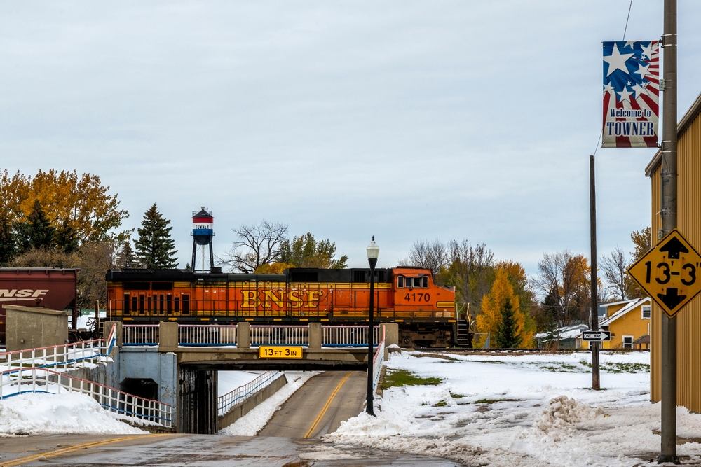 A train running through Towner on a snowy day.