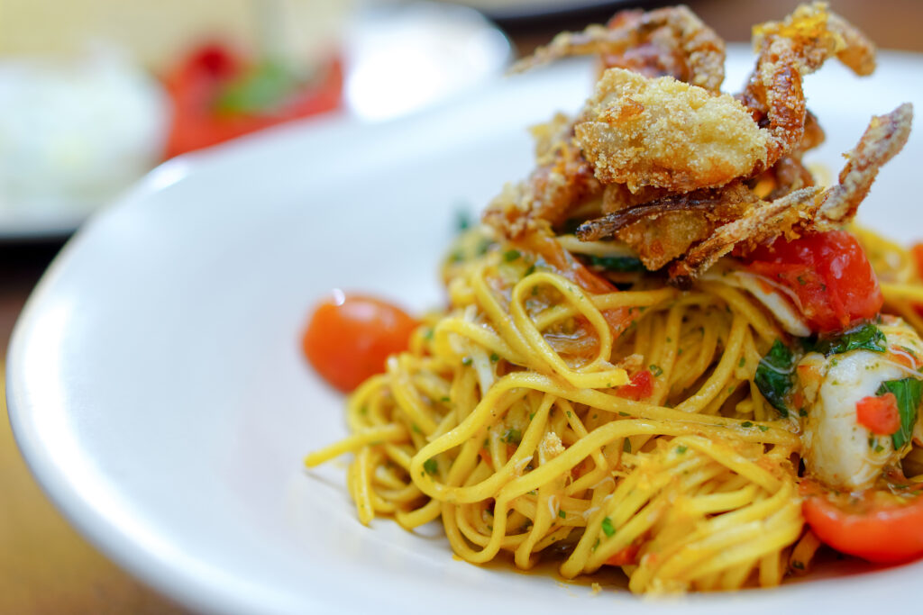 Italian fusion food - pan fried spaghetti with lobster in an article about the best restaurants in Cleveland