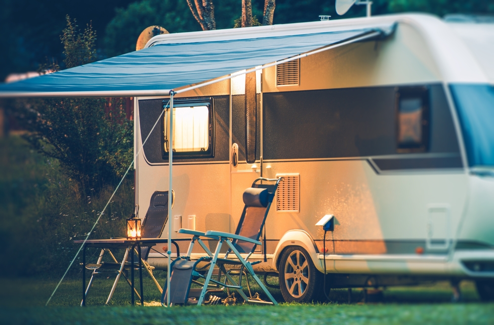 RV Park Camping at Night. With two seats outside and an awning