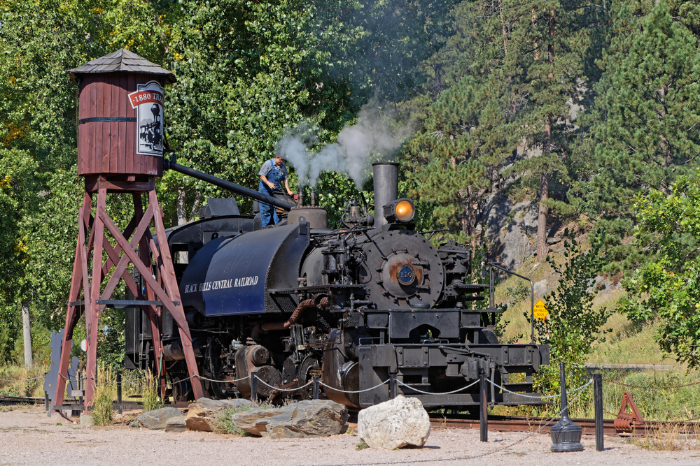 The 1880 Train being worked on with steam coming out.