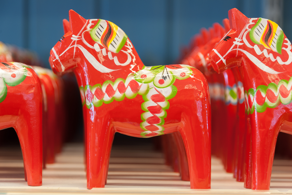 Display of red Swedish dala horses.