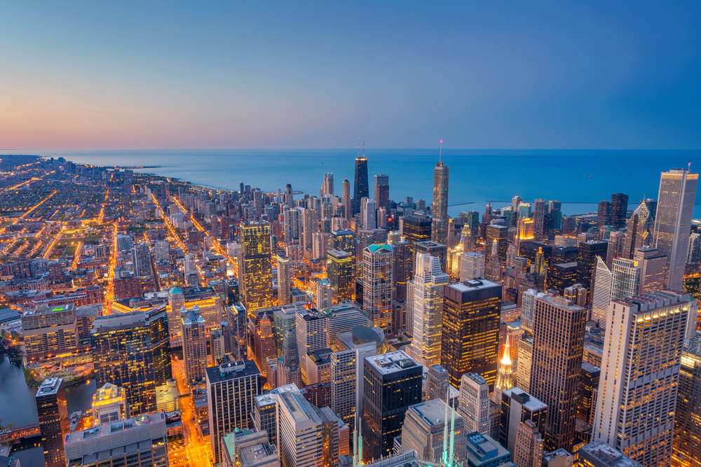 Aerial photo of the Chicago skyline at twilight showing where to stay in Chicago.