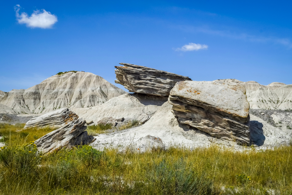 Big rocks scattered throughout the field hiking in nebraska