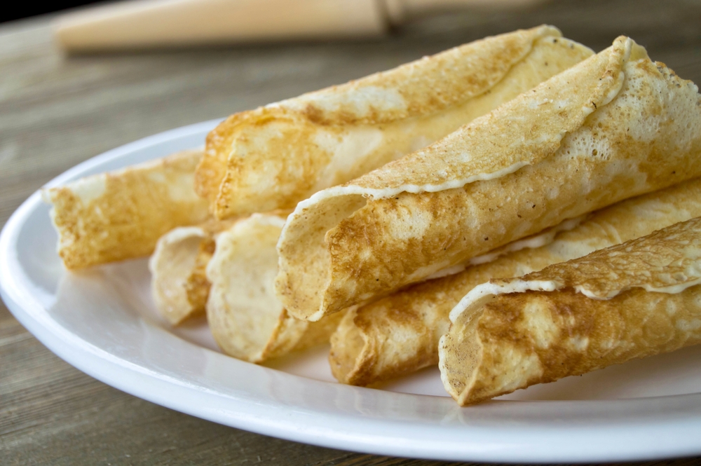 Plate of rolled krumkake, a Scandinavian dish.