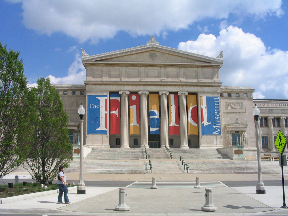 The front exterior of the Field Museum during a sunny weekend in Chicago