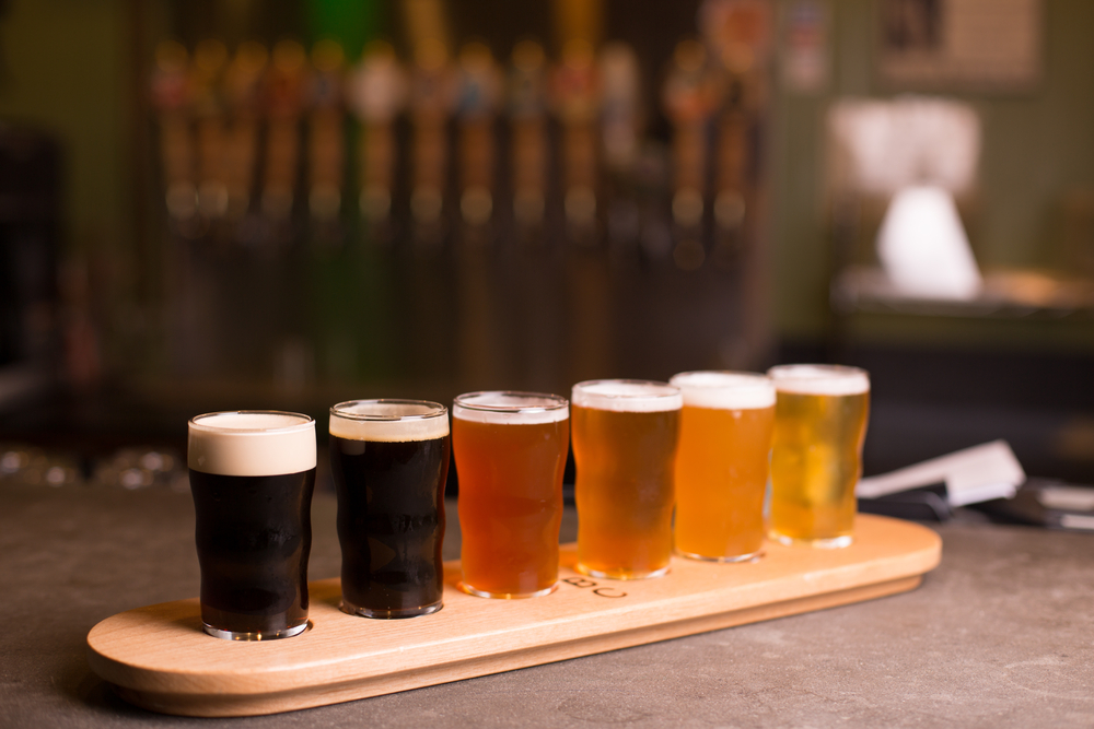 A flight with 6 beers ranging from darkest to lightest, similar to what you'll find at breweries in Chicago