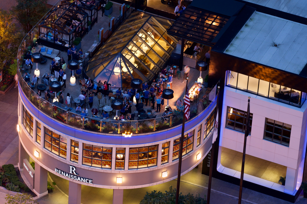 An aerial view of a rooftop bar at a hotel in Chicago at night
