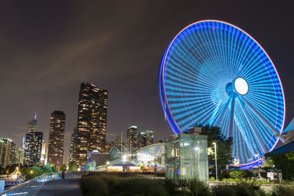 A time lapse image of the Navy Pier's Centennial Wheel and the Chicago skyline, one of the best things to do in Chicago at night