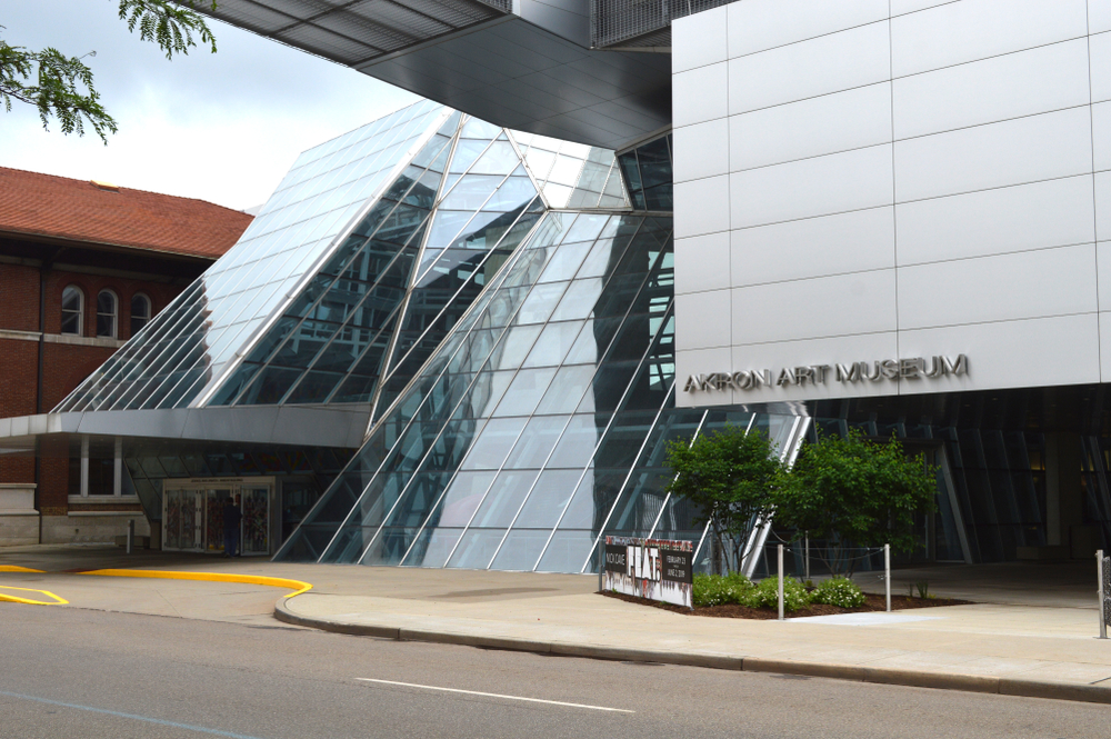 The exterior of the Akron Art Museum. It's a glass and metal building. 