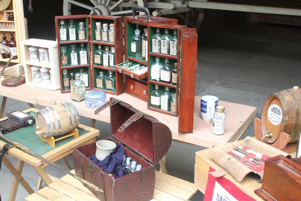 Old medicine equipment on display. featuring old medicine bottles 