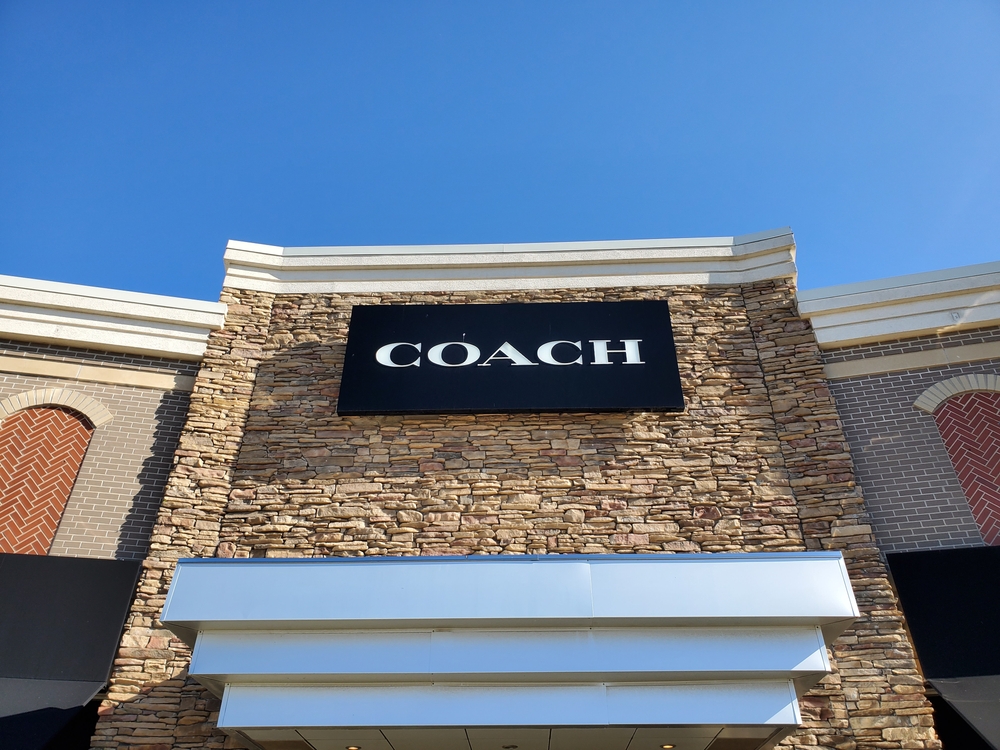 Business Sign for COACH Store at The Legends beneath Blue Sky. Visiting here is one of the things to do in Kansas City KS