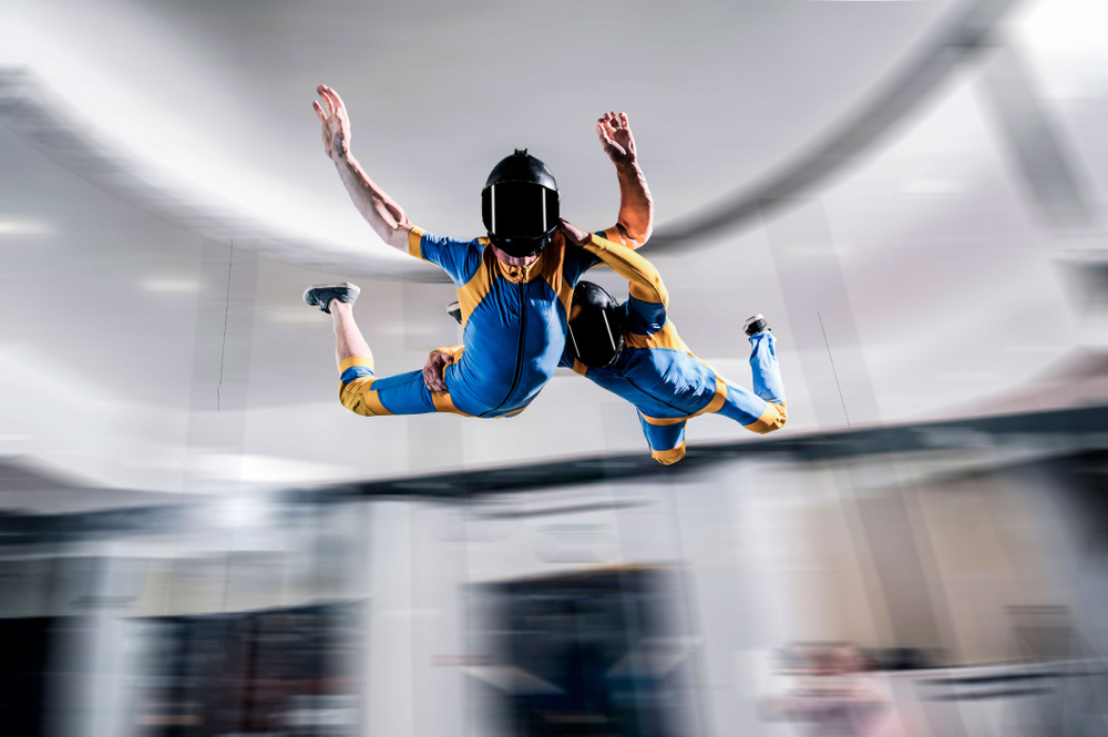 Flight free fall simulation. Peoples flight in wind tunnel. Indoor skydiving simulation. People doing skydiving in a wind tunnel wearing suits. This is one of the things to do in Overland Park. 
