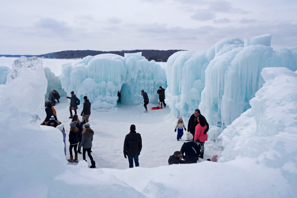 People in ice castles Wisconsin in winter