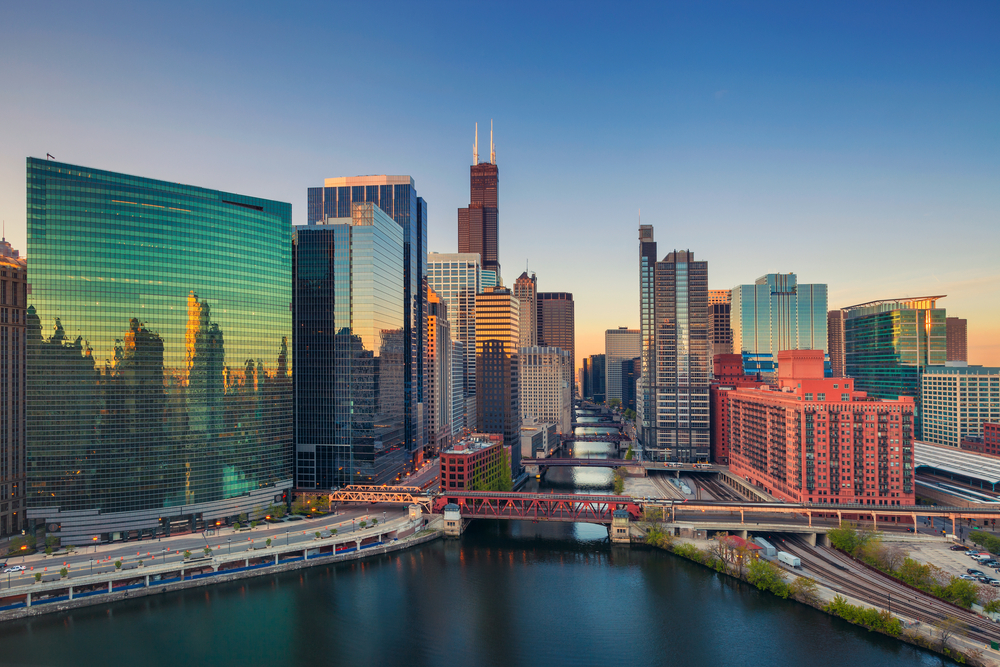 Aerial view of downtown Chicago with the river running through the skyscrapers.