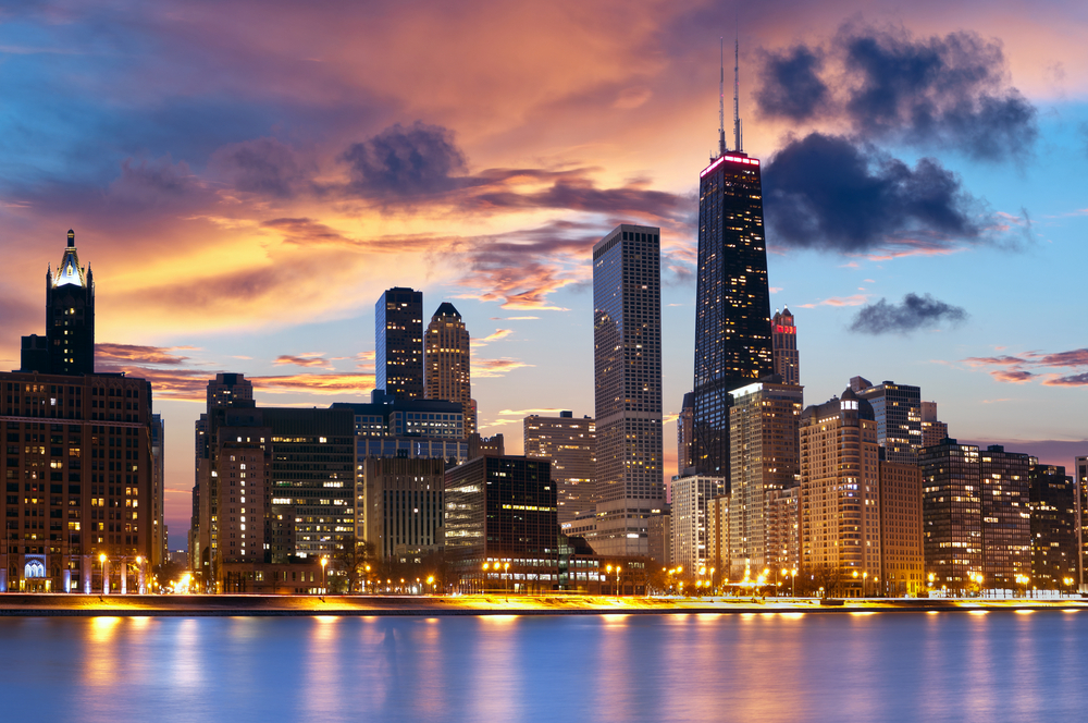 Vivid sunset over the Chicago skyline and Lake Michigan.
