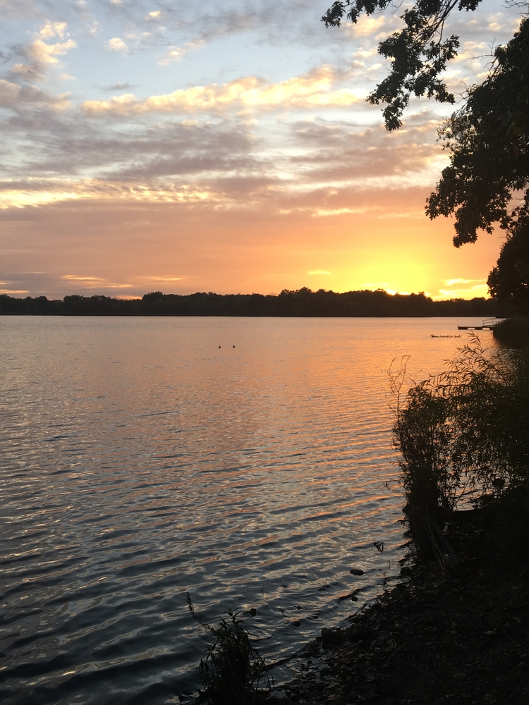 Orange sunset over Wingfoot Lake in Ohio.