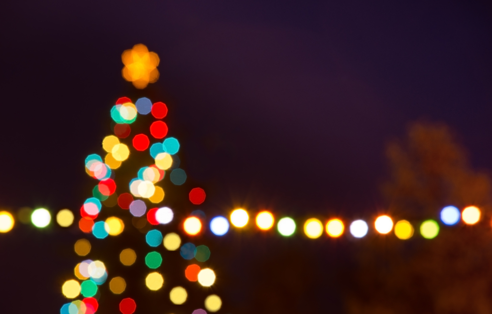 Christmas lights in Michigan blurred against the night sky 