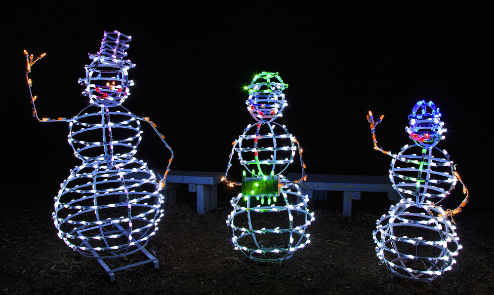 Christmas lights in Michigan featuring a Christmas display of three large snowmen 