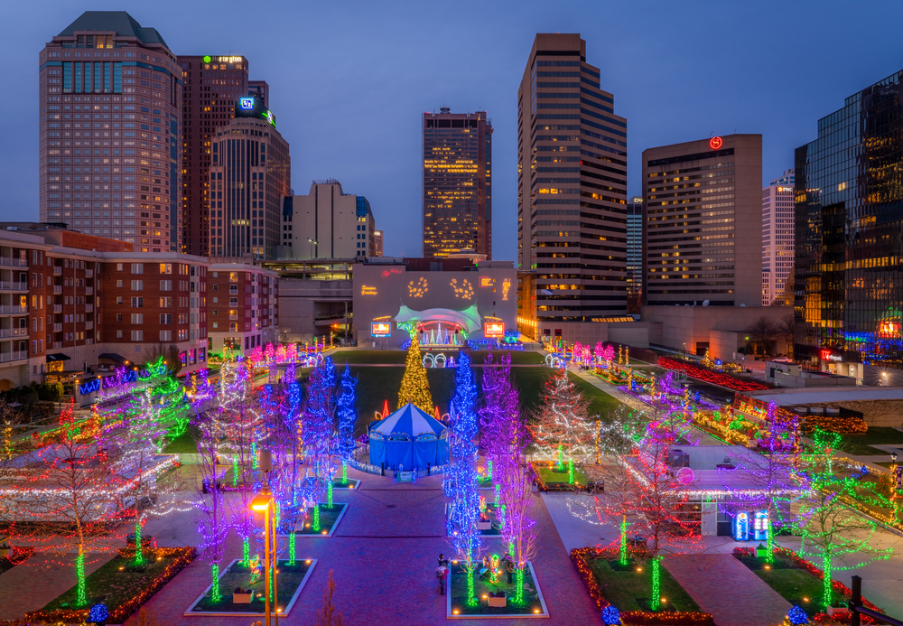 Columbus Commons Christmas lights in downtown Columbus shot early in blue hour. The photo shows decorated trees and light displays 