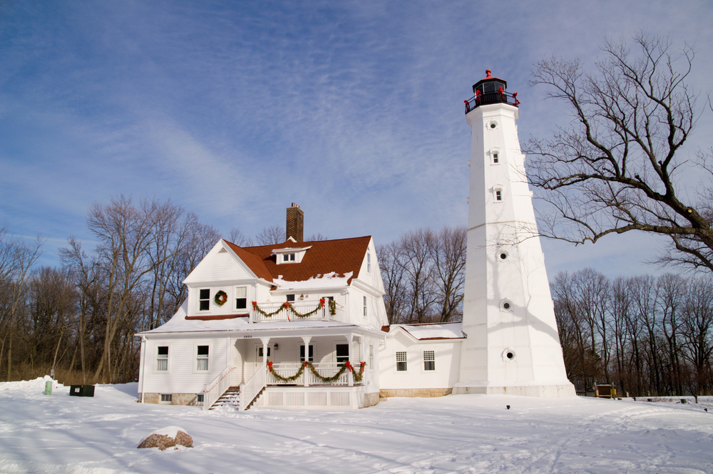 White Lighthouse surrounded by snow Wisconsin in winter