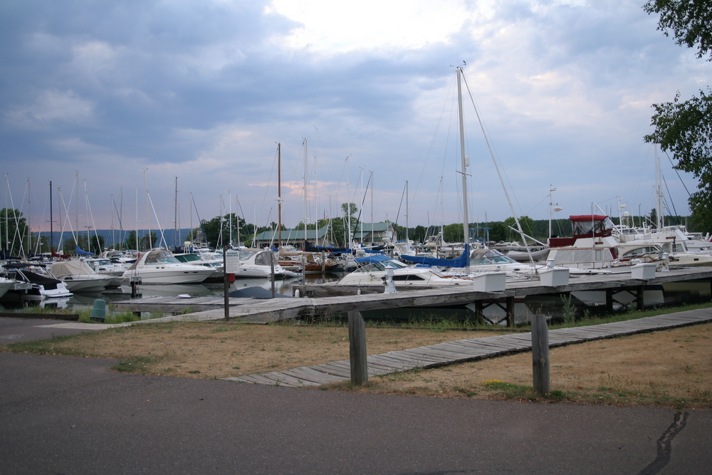 A marina full of boats on a cloudy day
