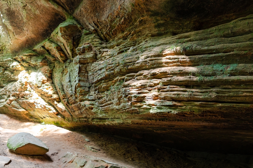 Looking inside of a rock formation that forms a small cave