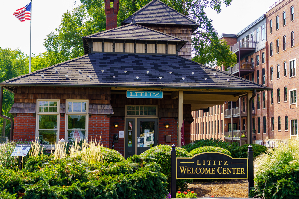 he Lititz Welcome Center is located at the Lititz Spring Park in the downtown area. It's a small building with a sign in front. 