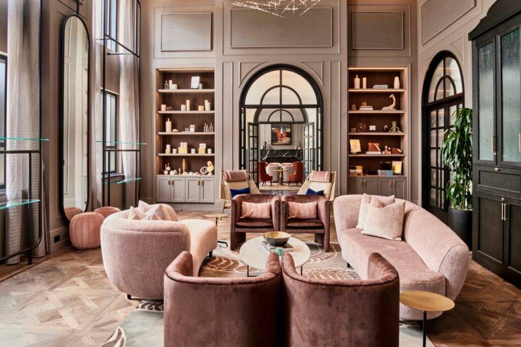 Beautiful lounge room with plush, pink seating at the Daxton Hotel in Michigan.