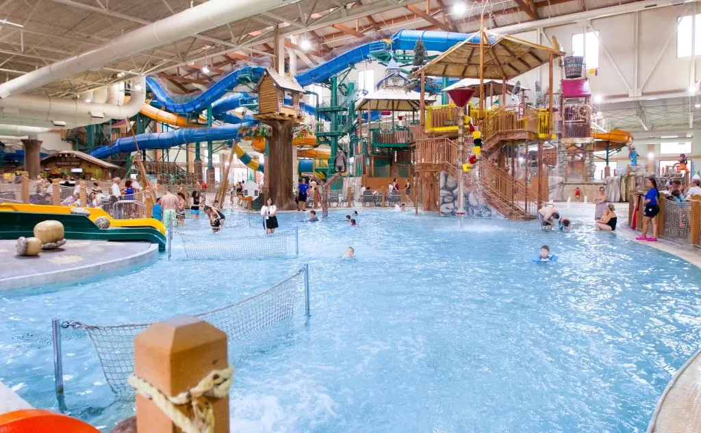 Indoor water park at Great Wolf Lodge with pool and slides.