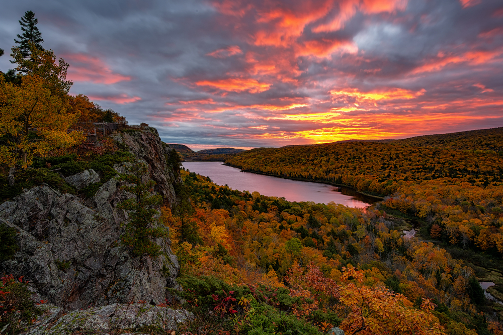 Beautiful sunset over Michigan forest and lake during fall.