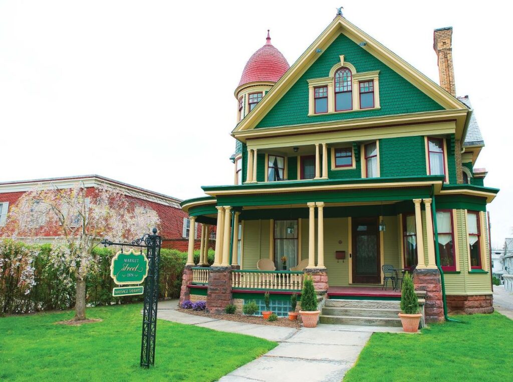 A green and yellow Victorian home in Ohio
