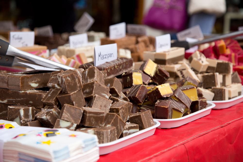 A selection of fudge at a stand with a red table