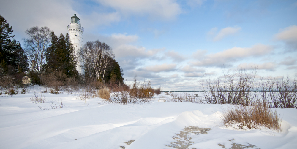Winter at the Cana Island Lighthouse in Door County, Wisconsin. The floor is covered in snow 