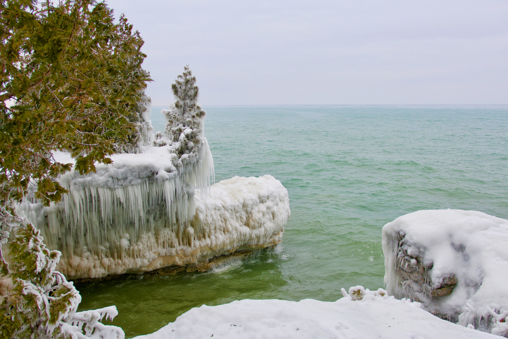 Ice from splashing waves at Cave Point County Park, Door County, Wisconsin. You can see the ice hanging over the cliffs in an article abut winter in Door County 