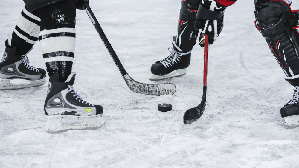 close-up with the puck during ice hockey game in article about winter in Door County
