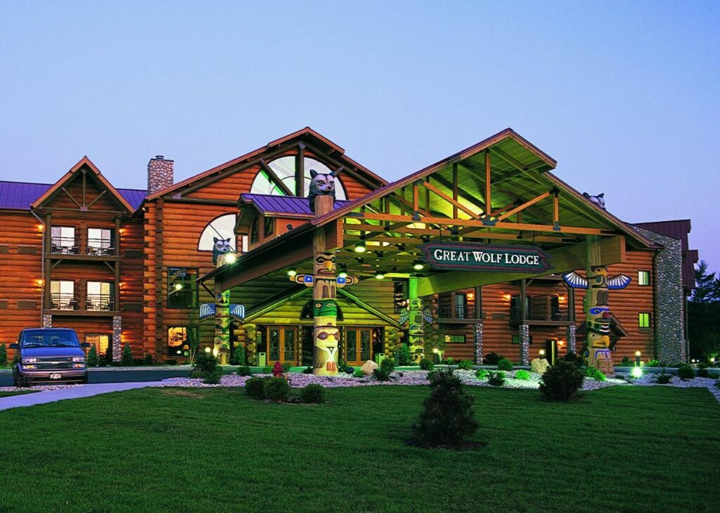 Exterior dusk photo of the log cabin themed Great Wolf Lodge one of the best ski resorts in Wisconsin.