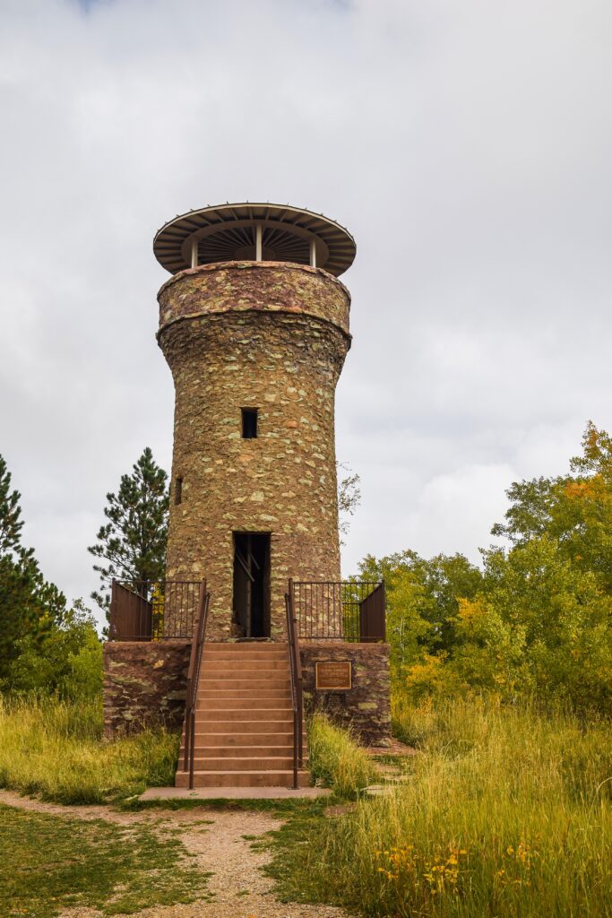 The stone Mount Roosevelt Friendship Tower on a cloudy, fall day.