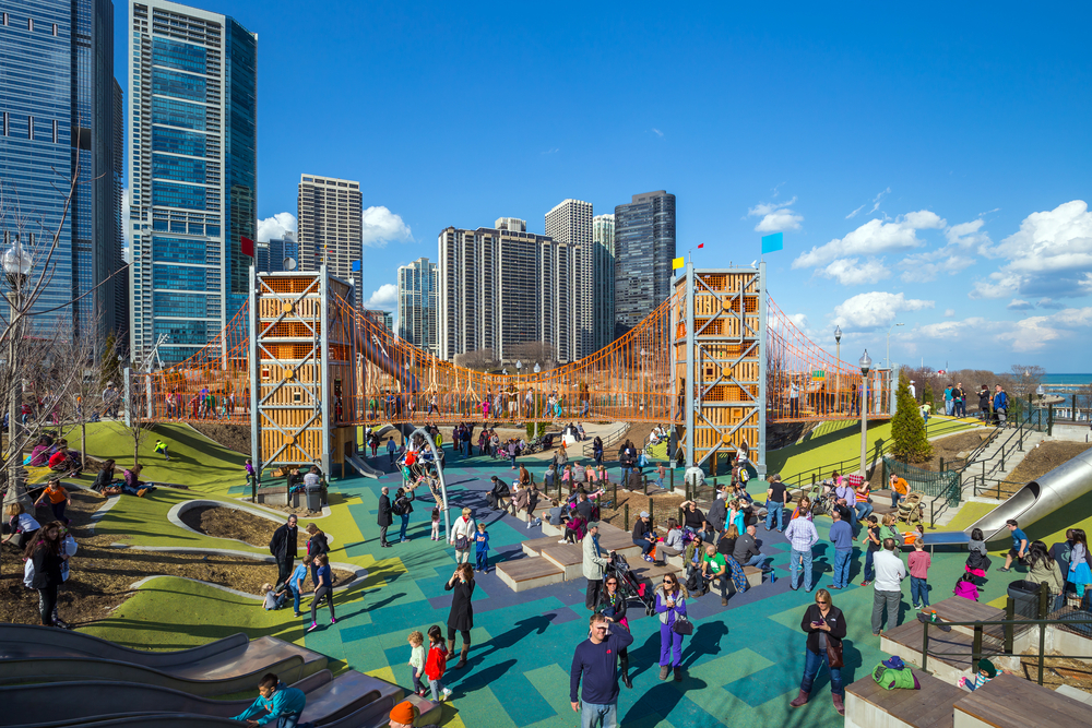 A huge playground in Maggie Daley park on a sunny day, one of the best things to do in Chicago with kids