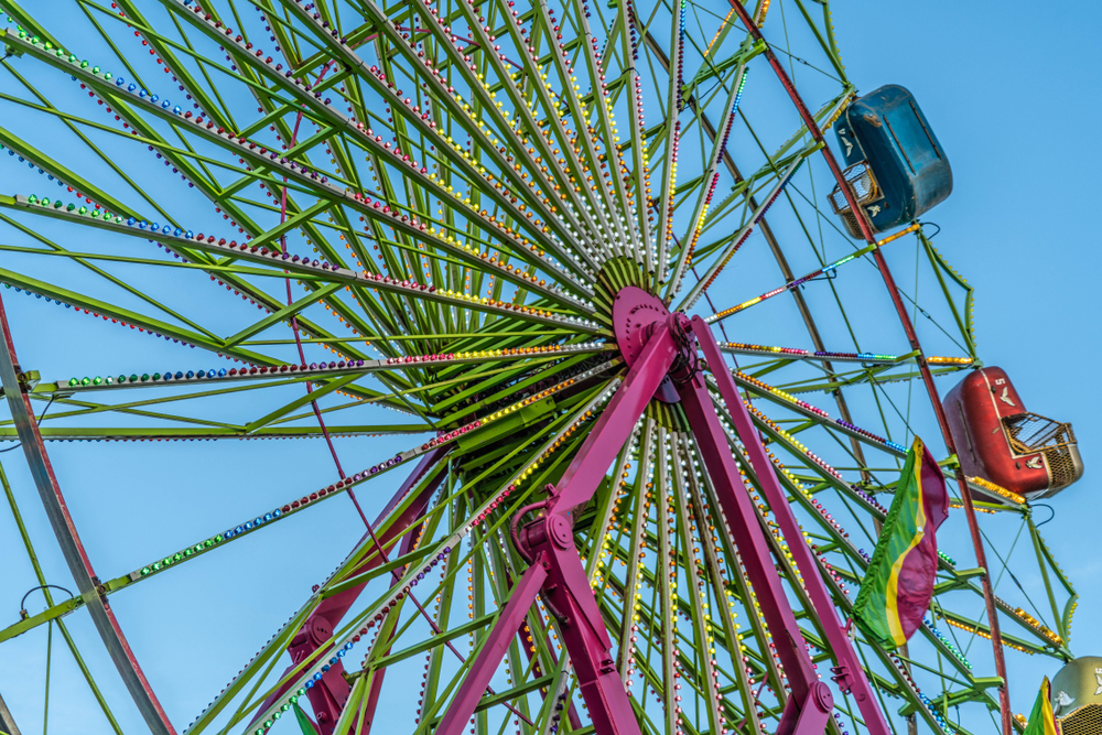 A large colorful ferris wheel at the Ohio State Fair on a clear sunny day