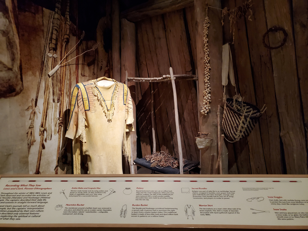 A display at the Lewis and Clark Interpretive Center with Native American clothes and tools.