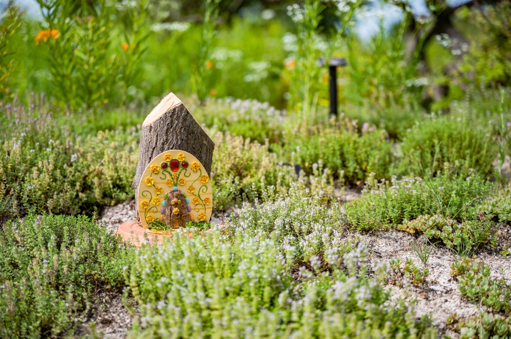 A prettily decorated fairy house in a garden at Holden Arboretum in Ohio.