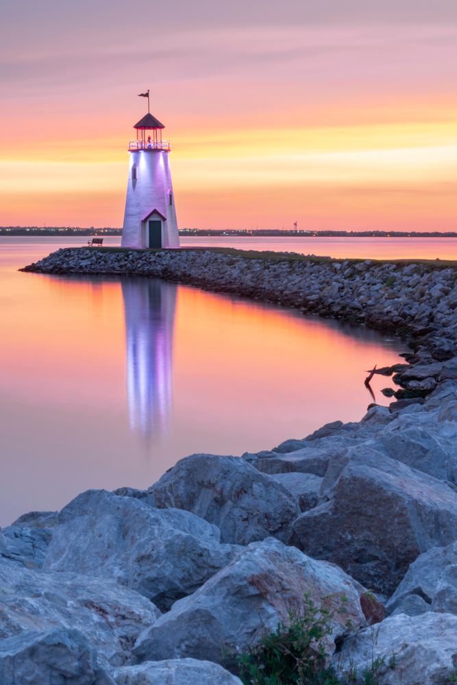 Colorful sunset over the lighthouse and Lake Hefner.