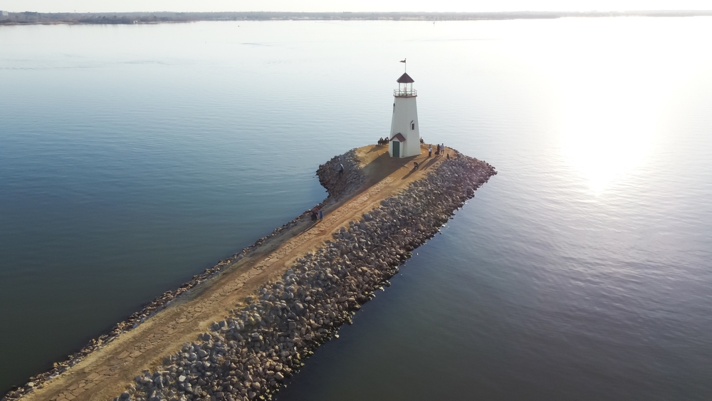 Aerial view of a lighthouse beside a Lake lakes in oklahoma