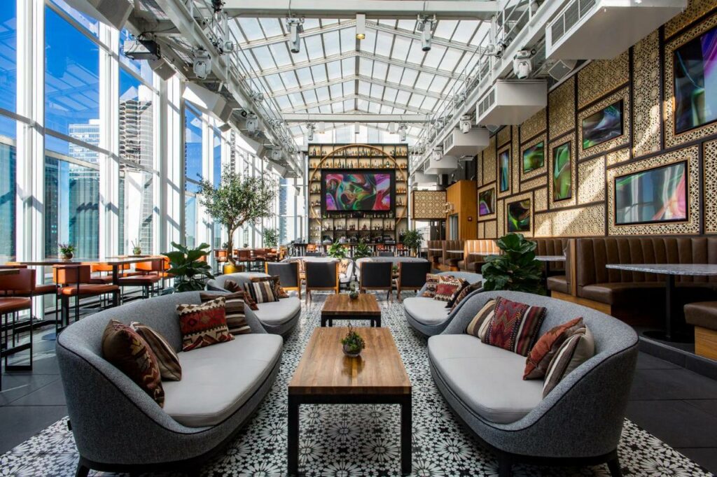 Bright, window-filled lounge bar at theWit Chicago, one of the best boutique hotels in Chicago.
