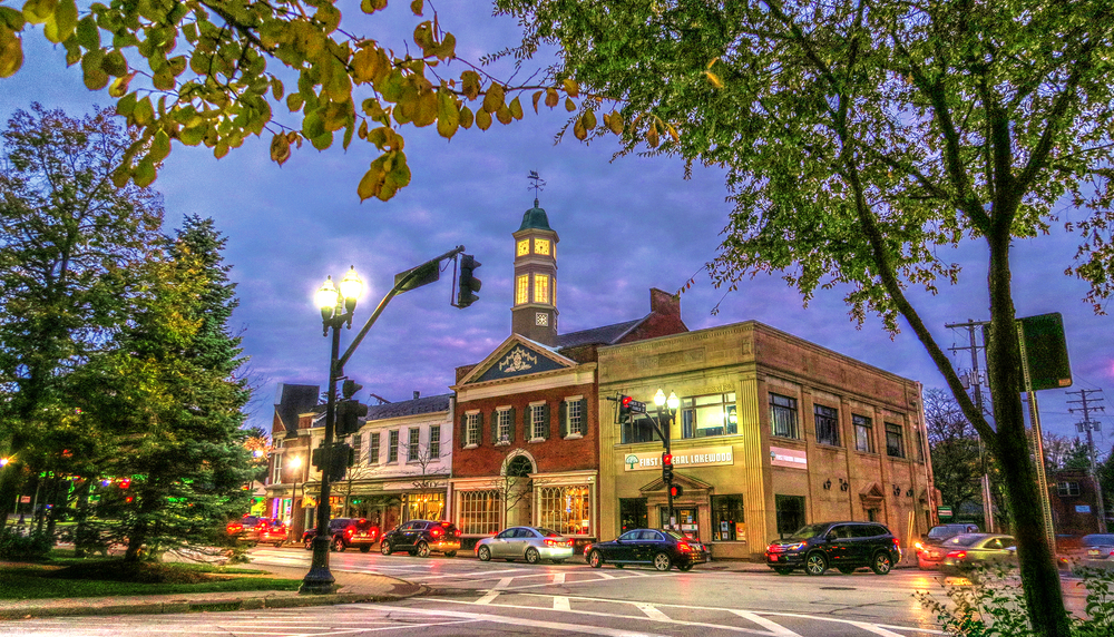 Warmly Lit Evening View of the Bank and Clock Tower at the Corner of Washington and Franklin in the Historic Village of Chagrin Falls