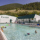 People swimming in the outdoor pool at Chico Hot Springs in Montana.