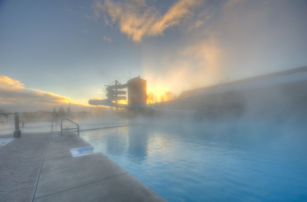 Steam rising from at outdoor pool at Fairmont Hot Springs Resort.