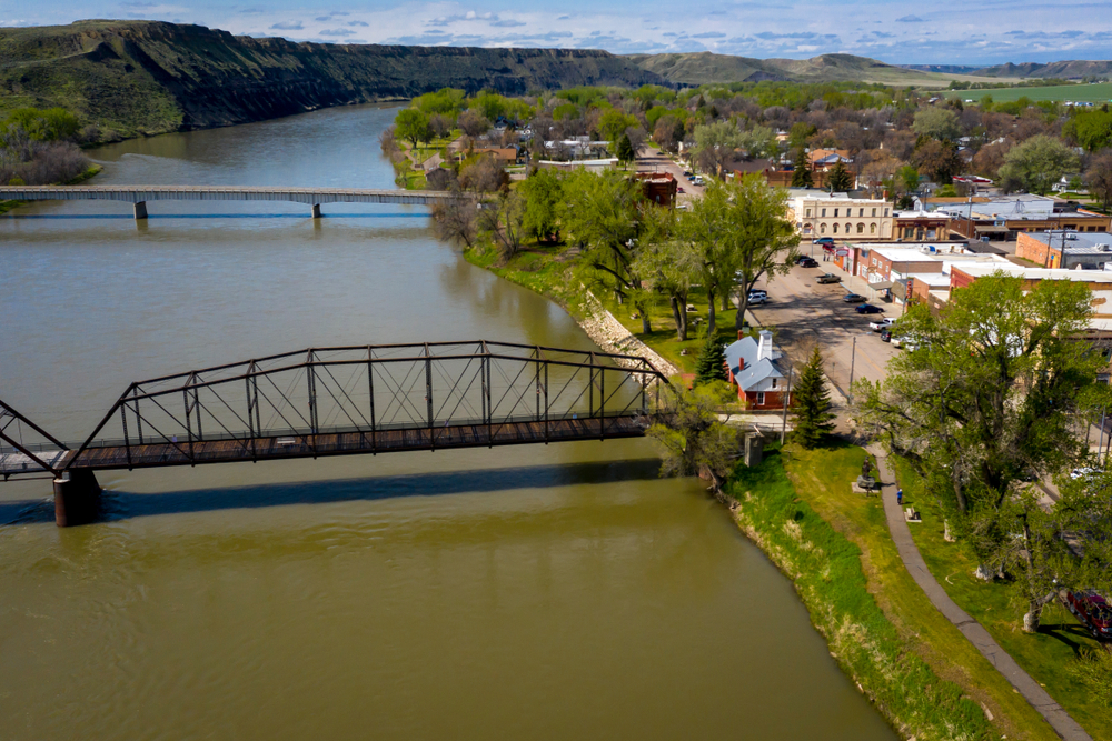 Aerial photo of Fort Benton featuring the river and bridges.