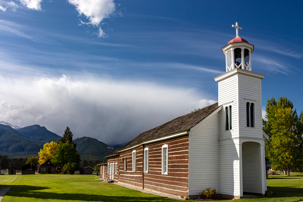 Old St. Mary's Mission with mountains in the distance.